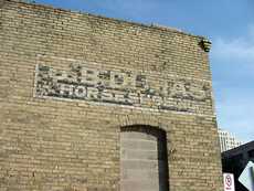 Ghost sign for horseshoeing in Austin
