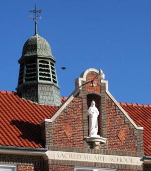 Sacred Heart School statue and weathervane