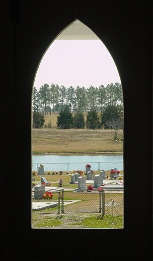 cemetery and pasture view from painted church window