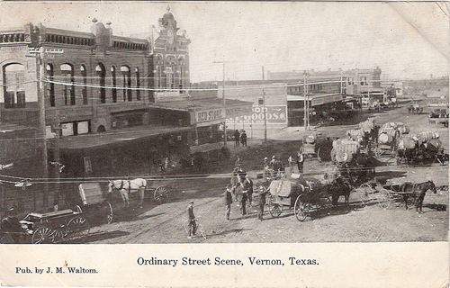 Vernon TX 1910s street scene with horse drawn wagons