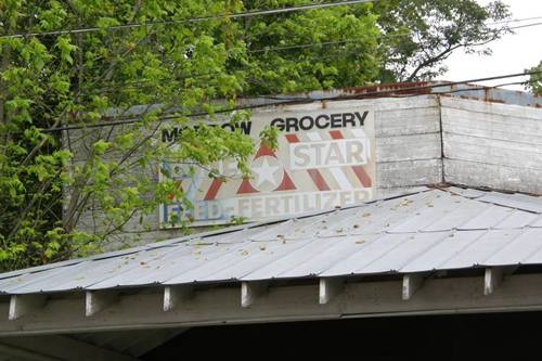 Flint Texas closed grocery feed store sign