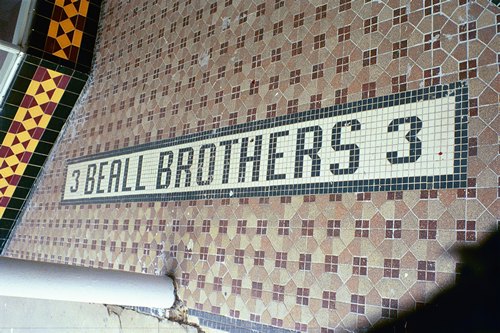 Beall Brothers tile sidewalk sign