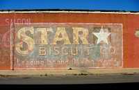 Movie artifacts Star Biscuit  sign on brick wall