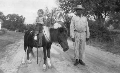 Girl on pony, and Sergeant, Brenham, Texas 1950s