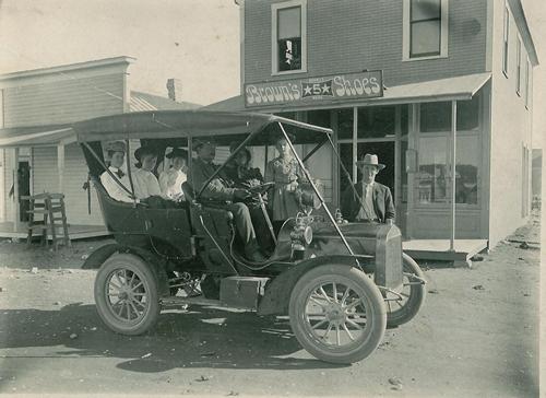 Ramsey family, car and Stark Store in Seminole, Texas