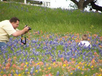 Independence TX Old Baylor Park Father photographing son amid Wildflower