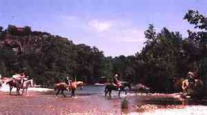 Concan TX - Horseback riding across Frio River 