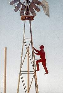 cowboy climbing windmill