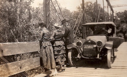 South TX Tourists with car on bridge, photo circa 1918