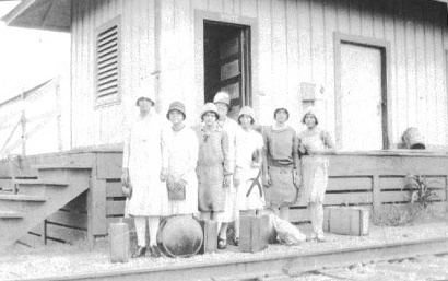 Mrs. Borden and Mexican girls on Mackay depot