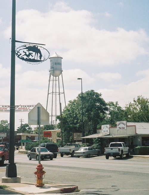 Downtown Bandera Texas,  water tower & cowboy metal sign