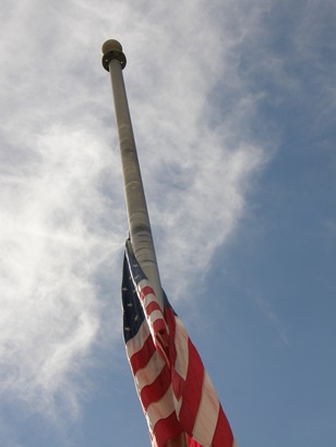 Flag flies over True To Union Monument in Comfort Texas