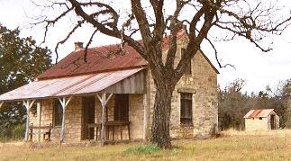 Grapetown stone schoolhouse with tree, Texas