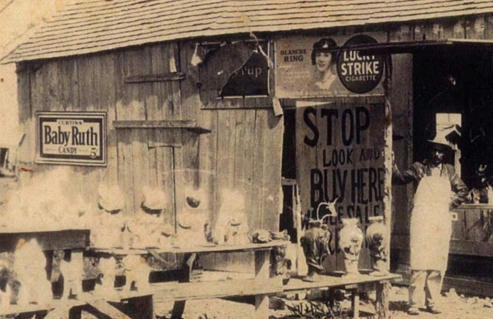 Vending tables displaying plaster animal figurines in Hunter, Texas, 1920s