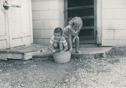 Ice house, boy and girl on Sandoval Store Texas