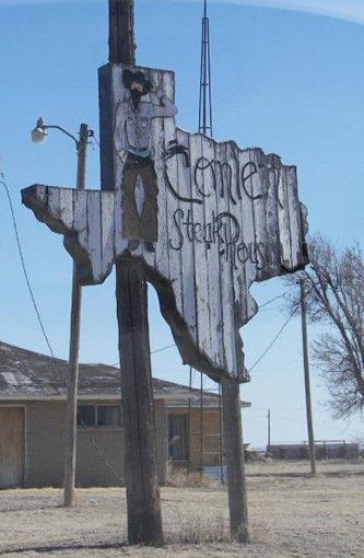 Cowboy on Texas State shape sign, Conlen Texas 