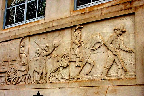 Graham TX Young County courthouse relief showing riders and wagon