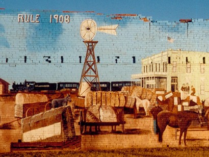 Rule Texas mural with windmill, cotton, train and horses